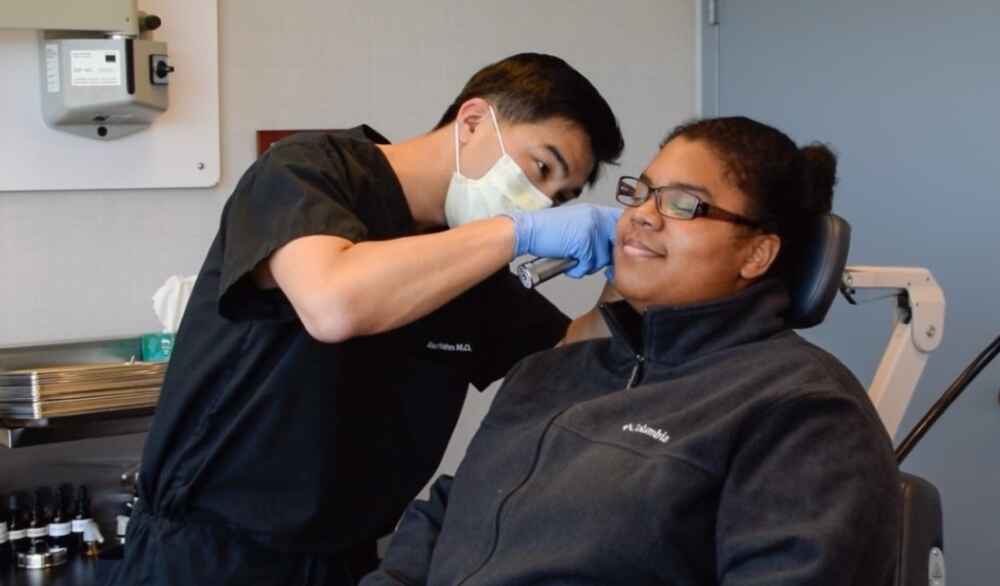 Doctor examining a patient's ear